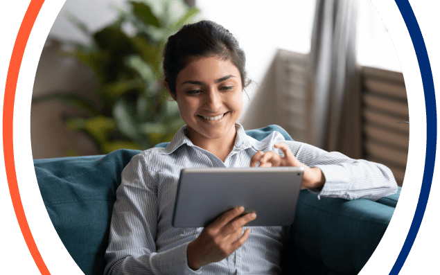 A student taking a proctored exam at home on a laptop with ProctorFree