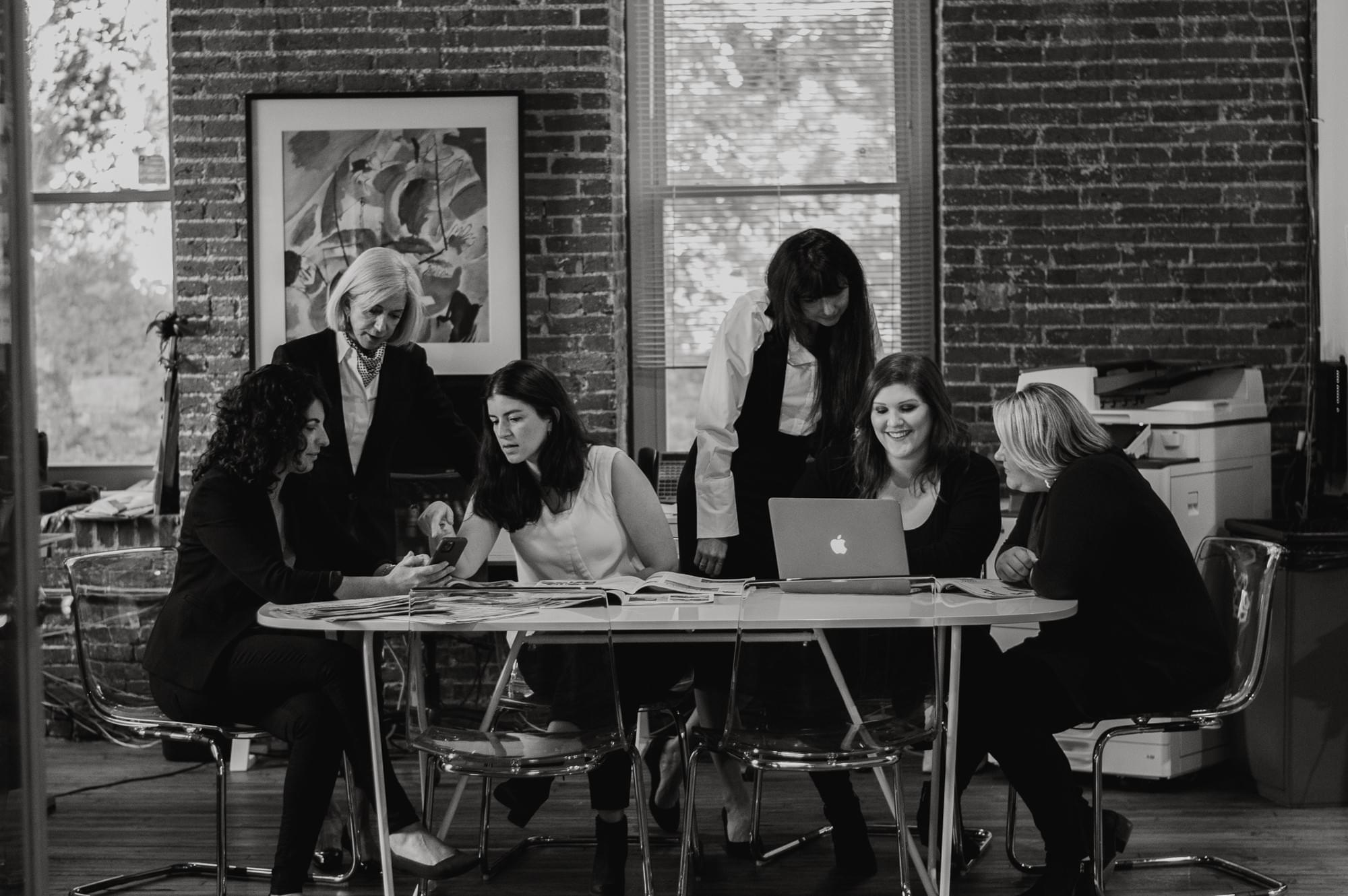 The PROFILES team gathered around a table in its Baltimore office