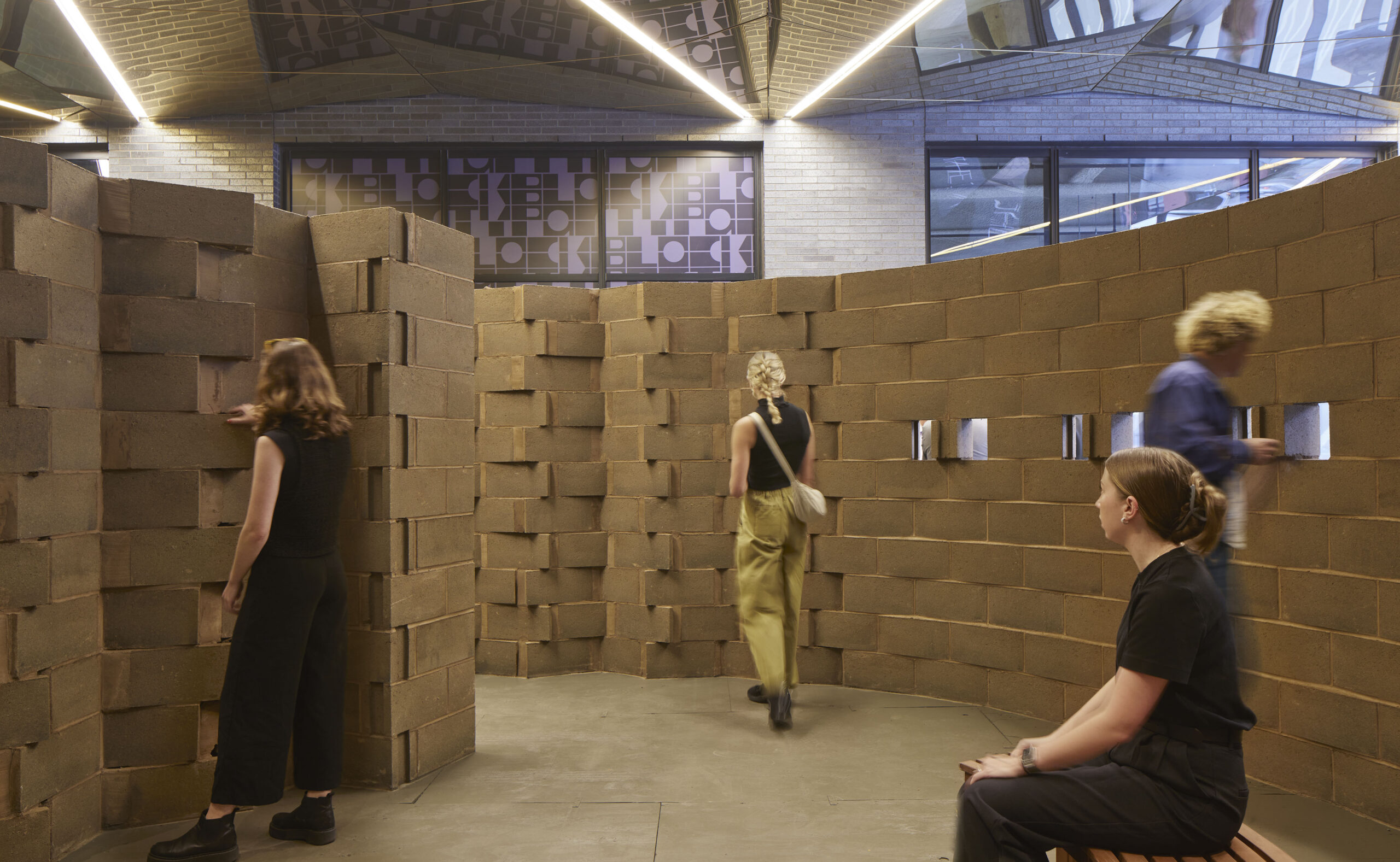 Visitors inside the curved Bio-Block Spiral at the Chicago Architecture Biennial