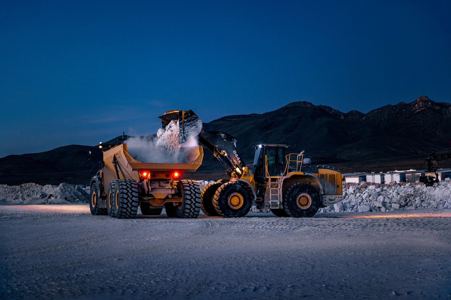 Pronto-equipped haul truck being loaded at sunset