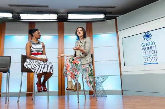 Two speakers onstage at the Gentry Women in Tech Conference 2019