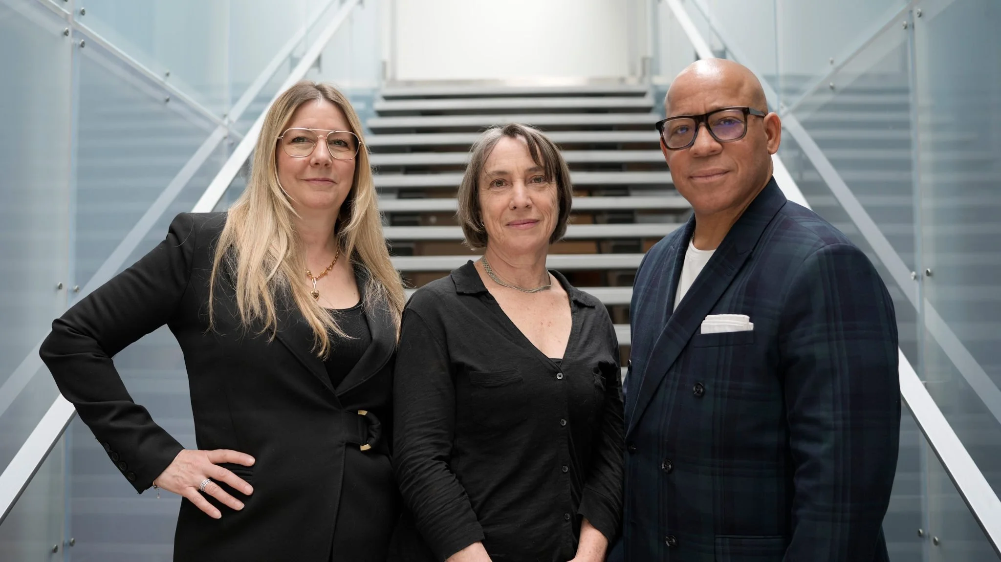 Mary Chambers, Catherine Parsons and Scott Pinkney standing together on a staircase