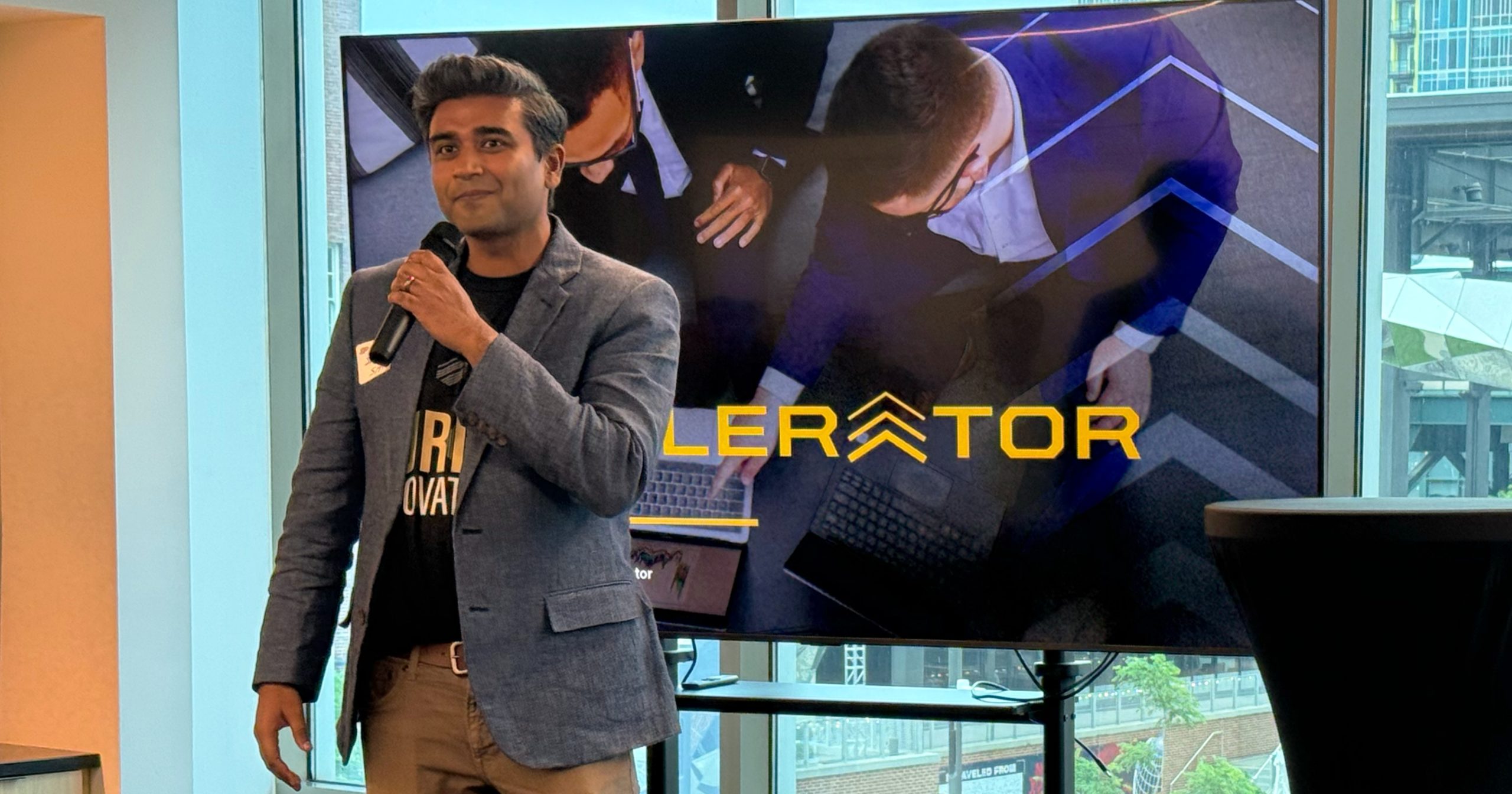 Second Opinion co-founder Samar Shah speaking with a microphone at a Purdue Innovates event