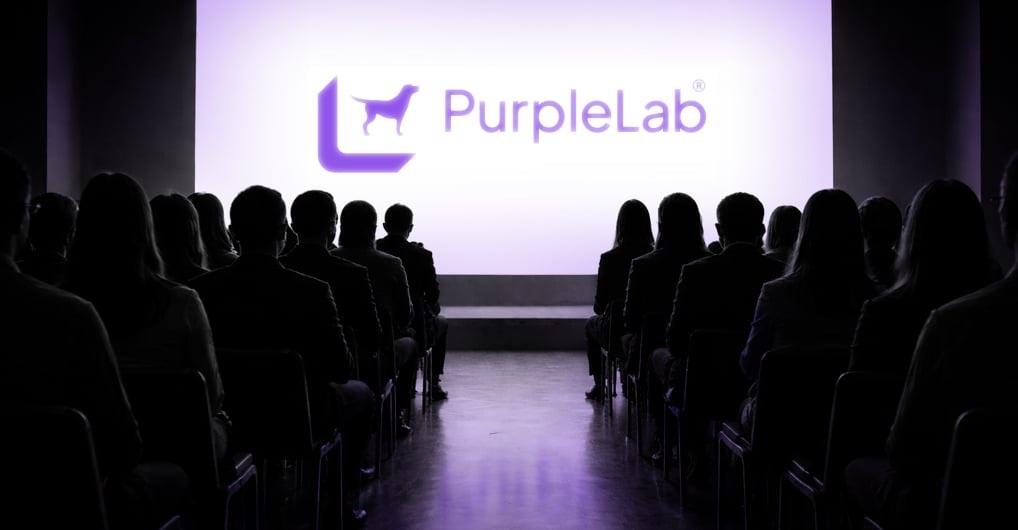 Audience facing a projected PurpleLab presentation