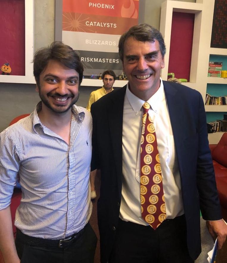 Qasim Asad Salam standing beside venture investor Tim Draper