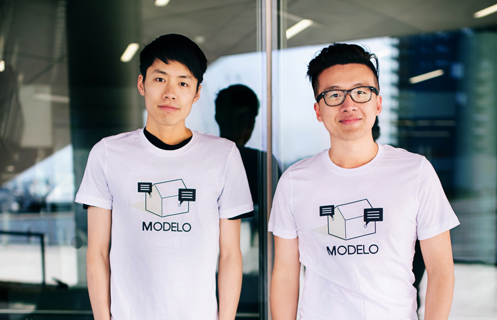 Modelo co-founders Tian Deng, left, and Qi Su, right, wearing Modelo T-shirts