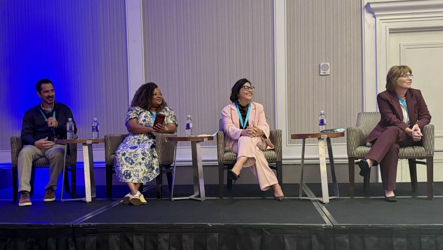 Four healthcare revenue cycle client panelists seated on stage at Quadax’s 2026 Xpeditor User Conference