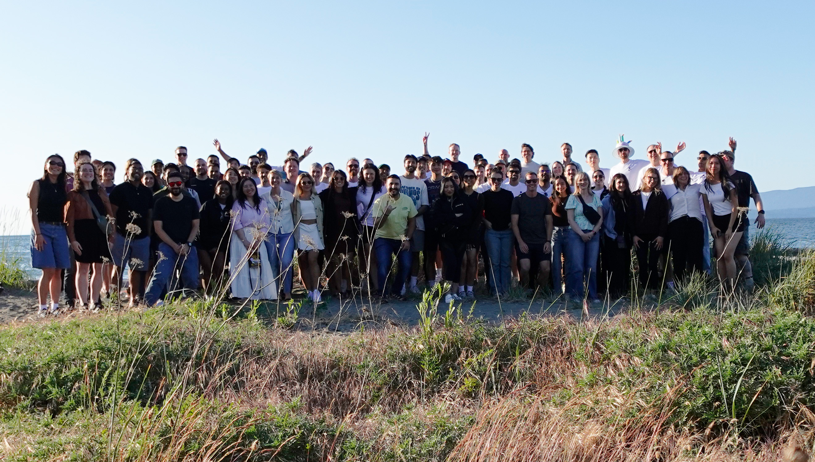 Quandri team outdoors near the water in June 2025