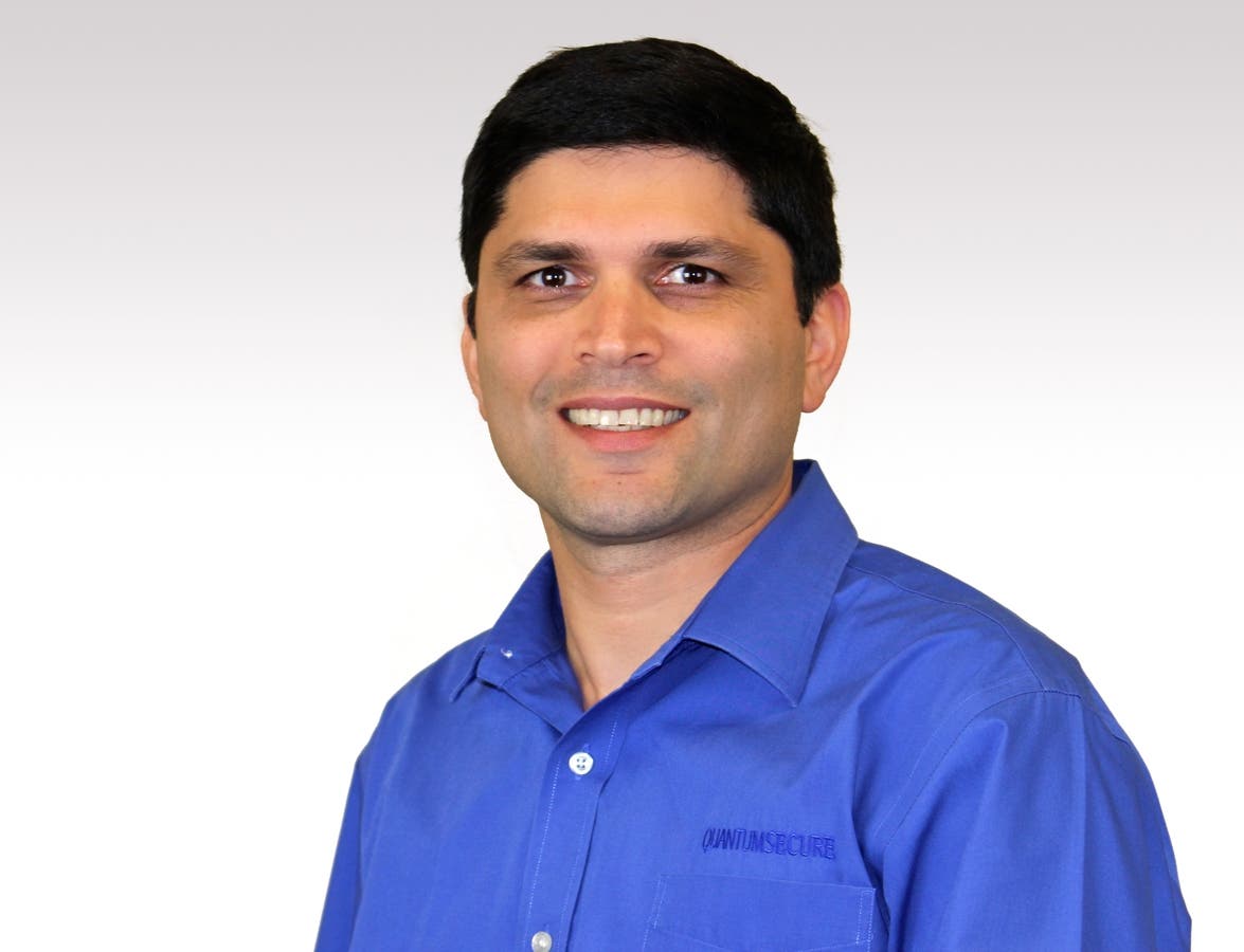 Quantum Secure co-founder Vik Ghai wearing a blue Quantum Secure shirt