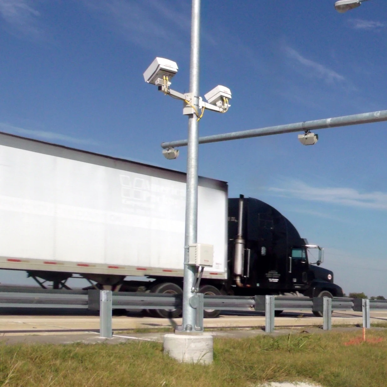 A truck passes roadside vehicle screening equipment