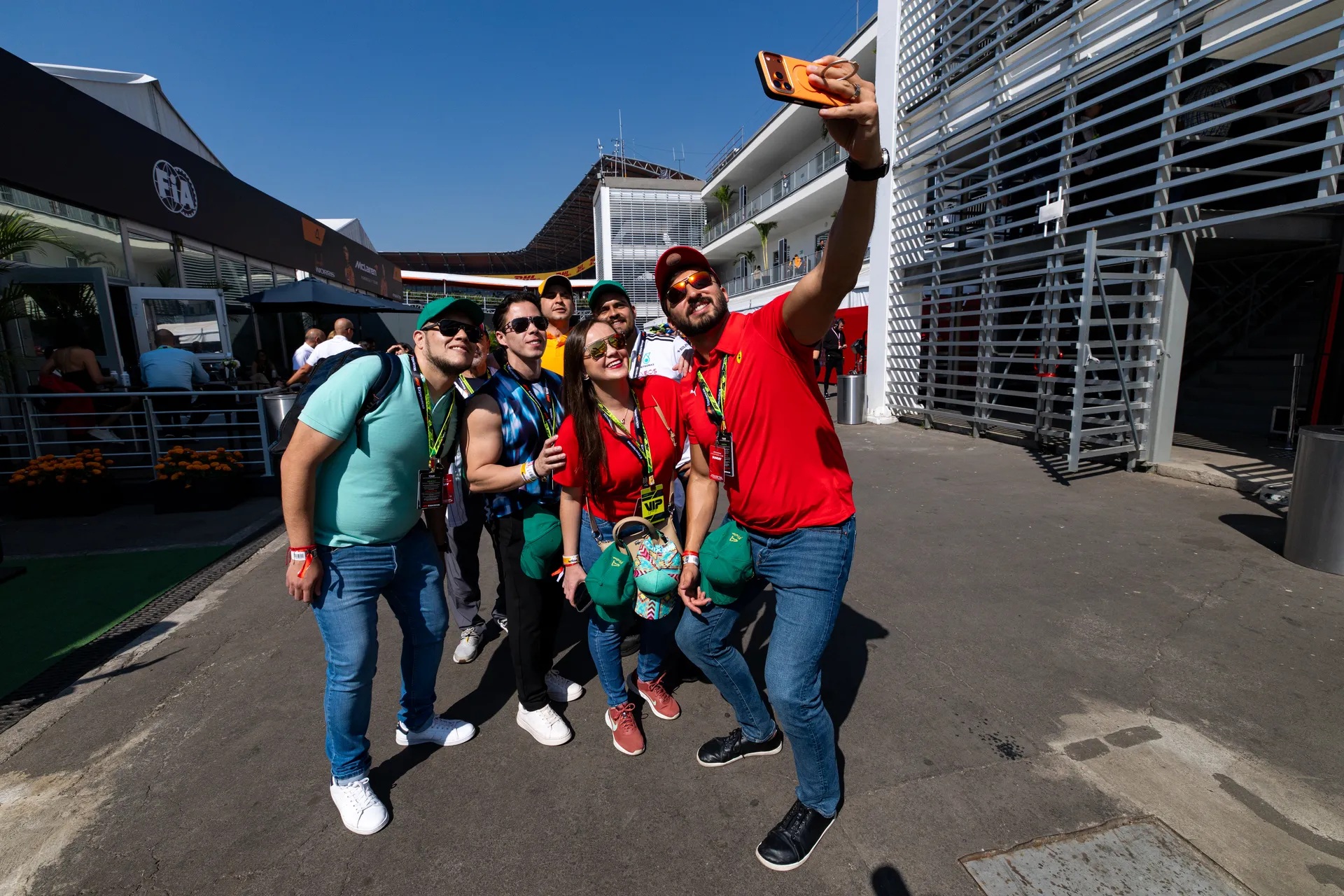 F1 Experiences guests gathering for a selfie in the Mexico Grand Prix paddock