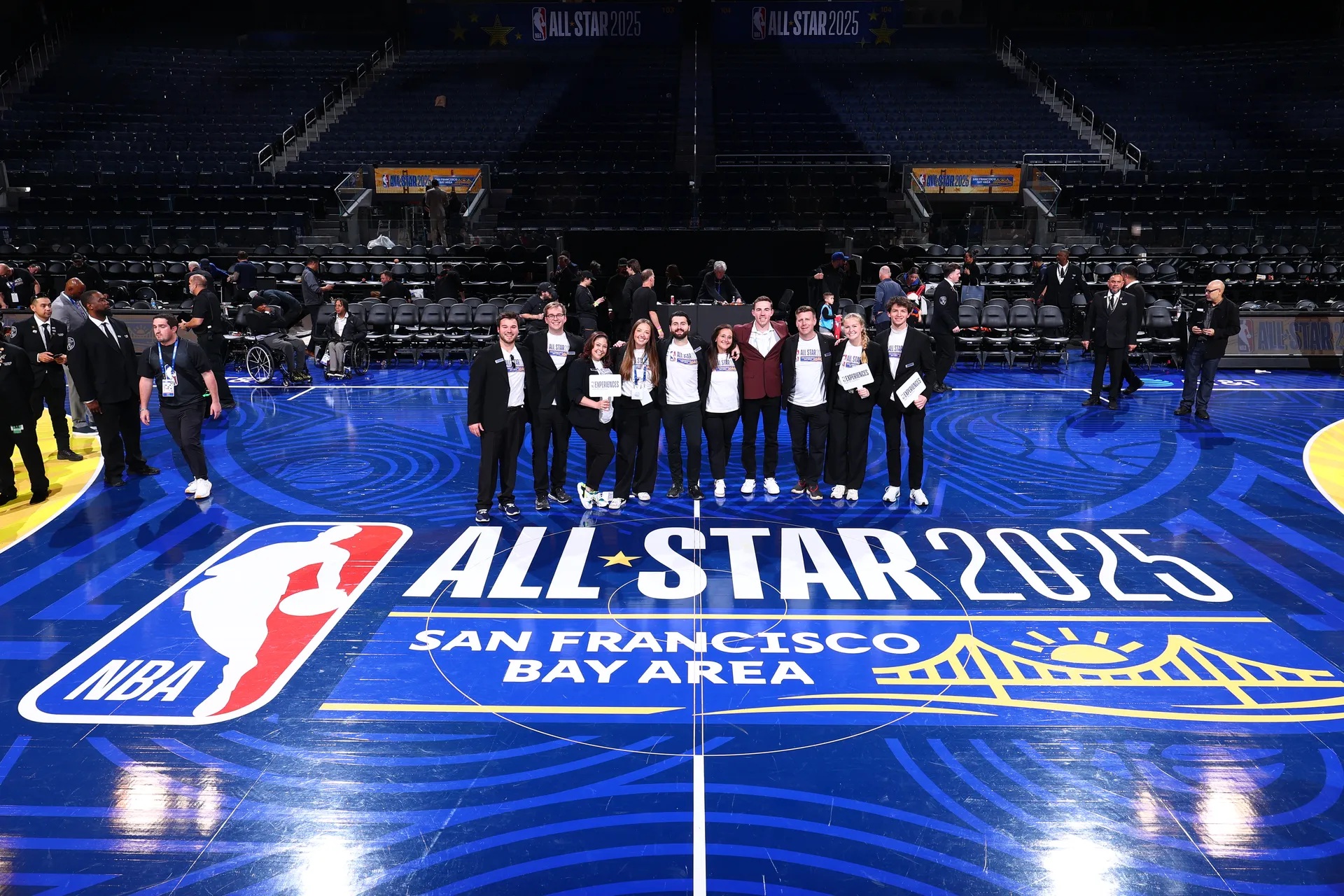 Quint event staff lined up on the NBA All-Star 2025 court in San Francisco