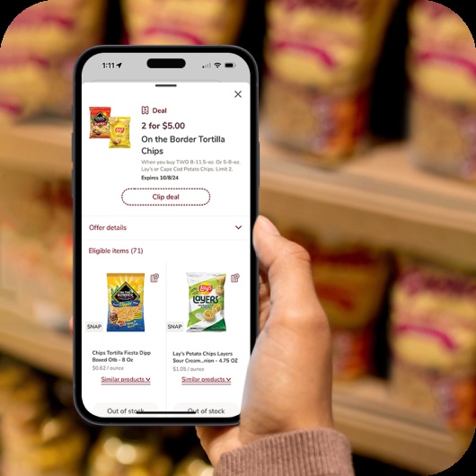 Neptune product illustration showing a shopper viewing a digital tortilla-chip offer on a phone in a grocery aisle
