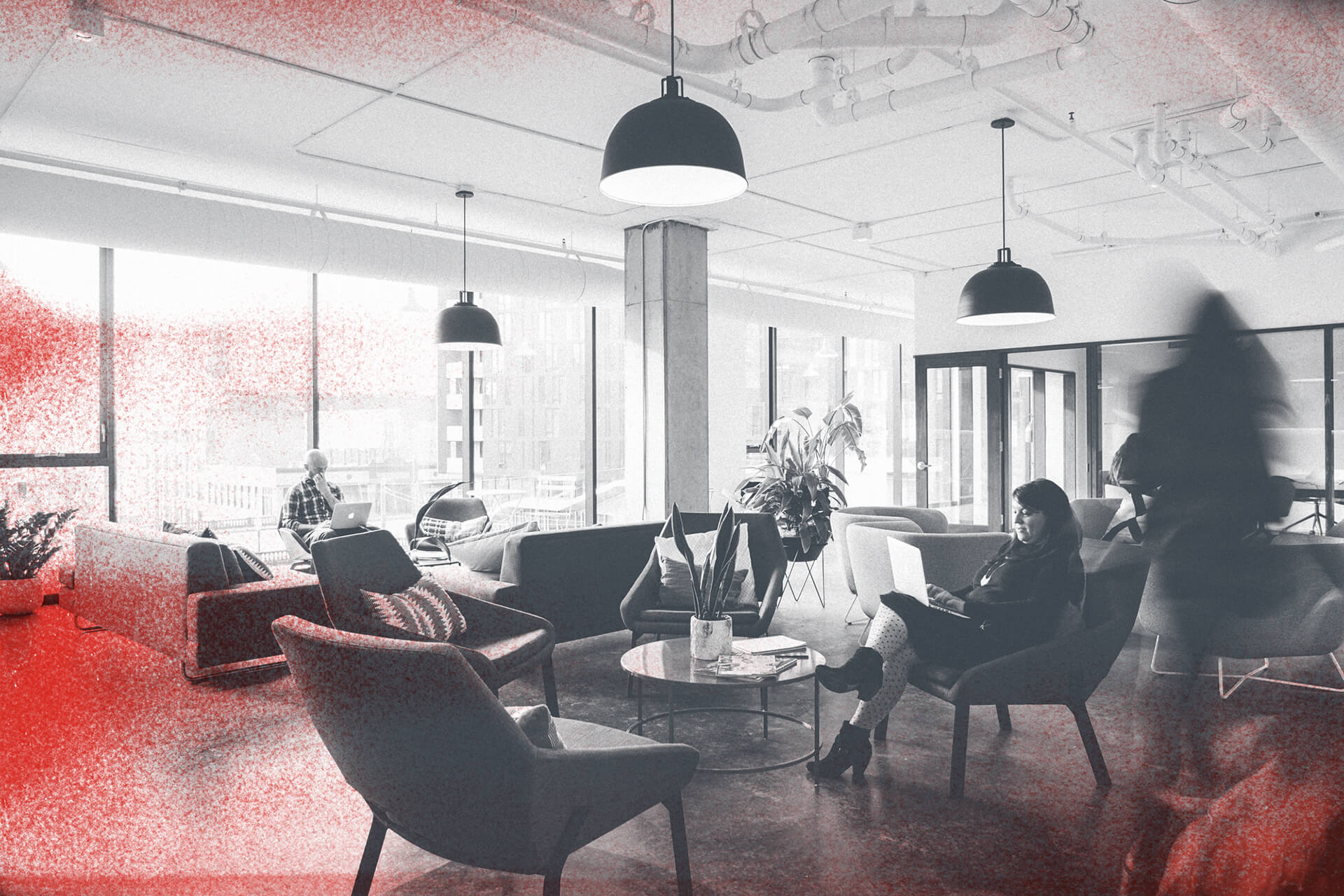 The R West office, with team members working among lounge chairs and large windows