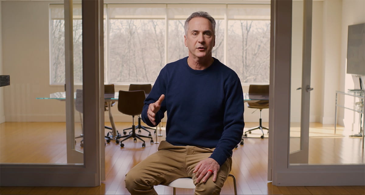 r4 Technologies founder Paul Breitenbach seated in the company's office