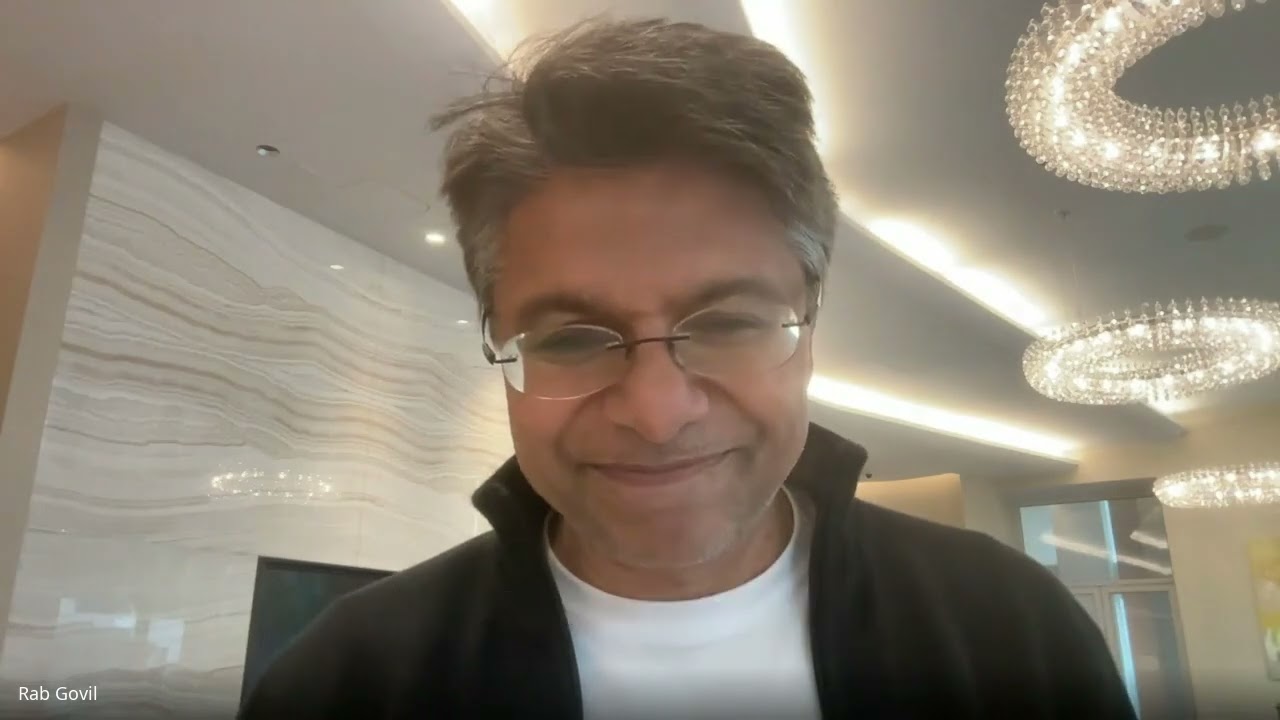 Rab Govil smiling during his Informationbanker video interview