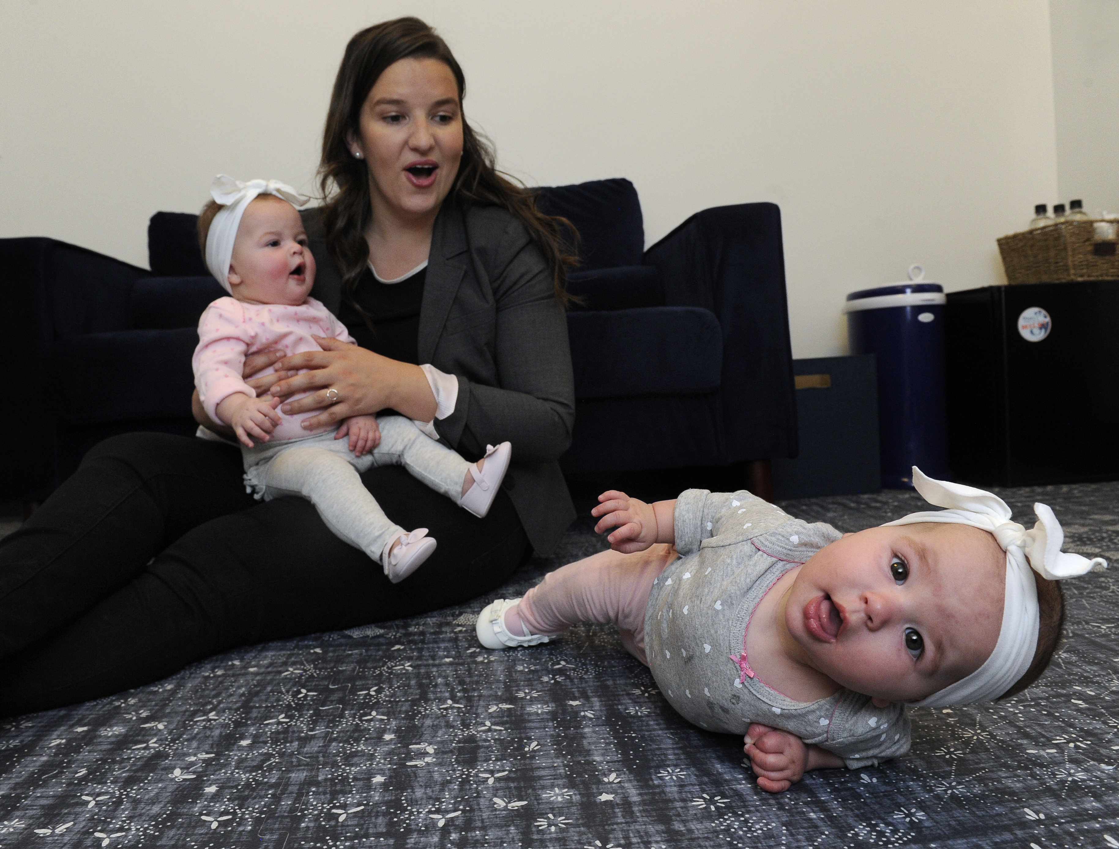 Rachel Romer with her twin daughters during a visit to Guild’s Denver office in 2018