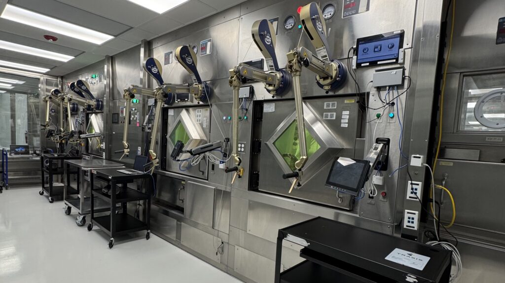 Shielded manufacturing equipment with remote manipulators at RadioMedix’s SPICA Center