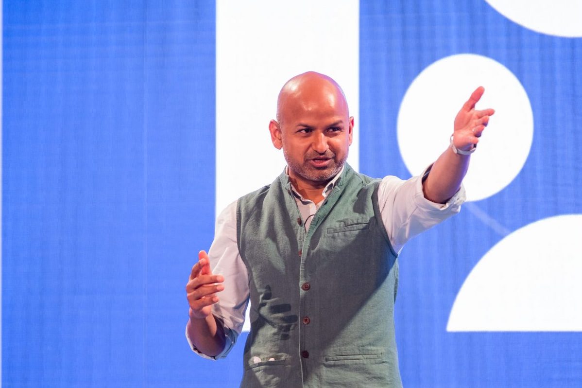 Rafat Ali speaking onstage at the Skift Europe Forum