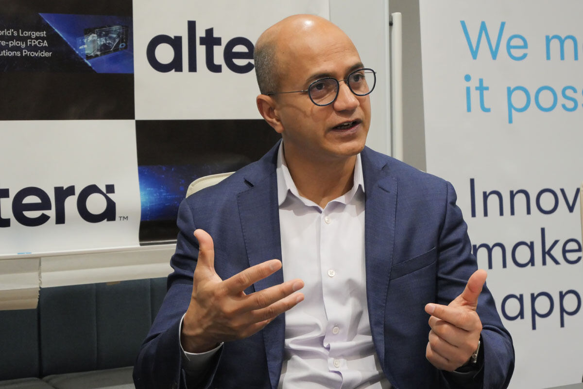 Raghib Hussain speaking during an interview in Japan, gesturing with both hands
