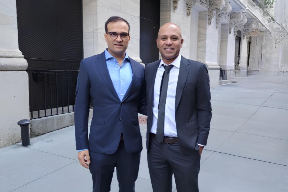 Pavitar Singh on the left and Ragy Thomas on the right, standing outside in suits