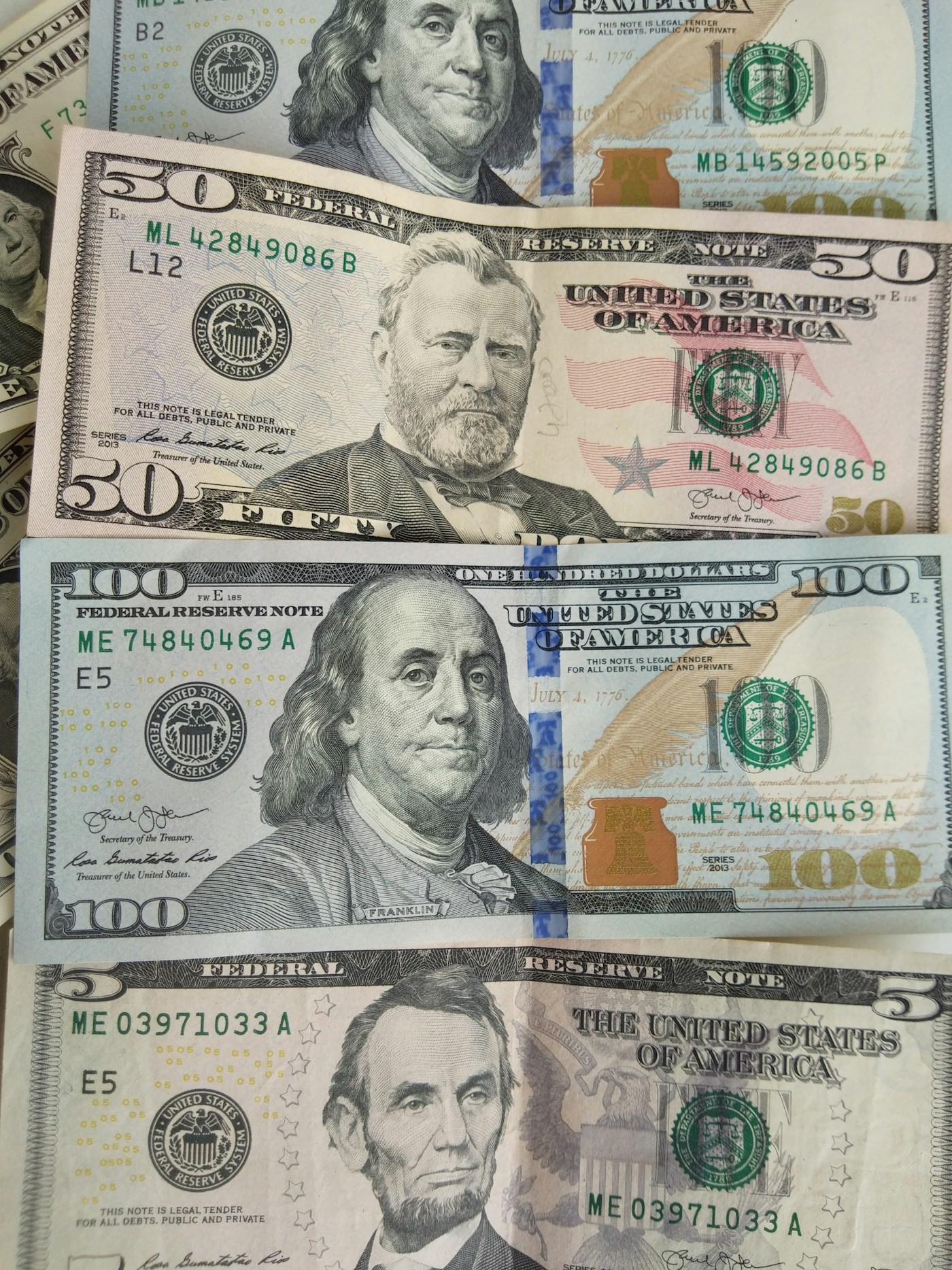 Close-up of overlapping US banknotes