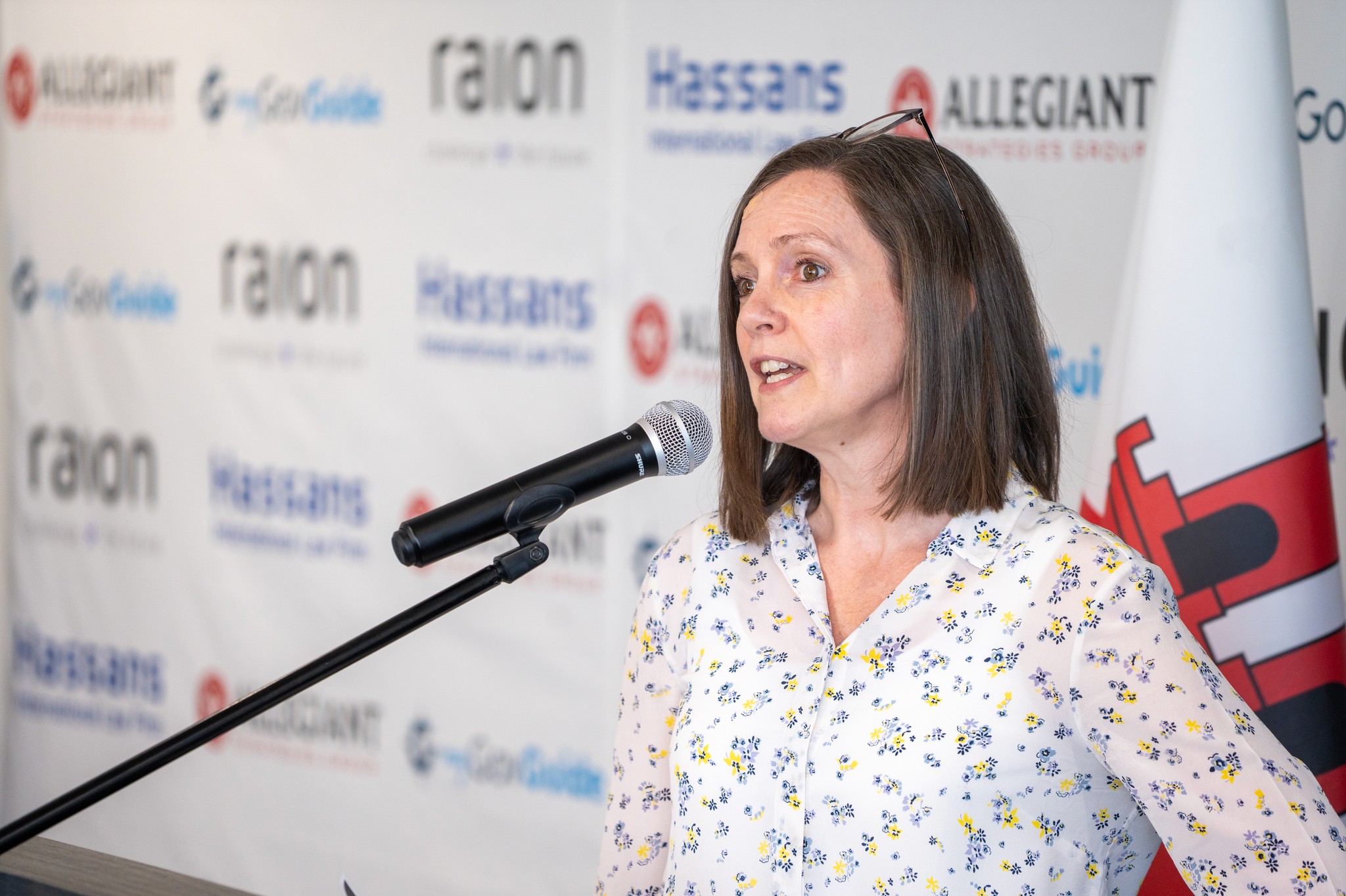 A speaker at a microphone in Raion’s 2025 Sovereign AI Forum gallery