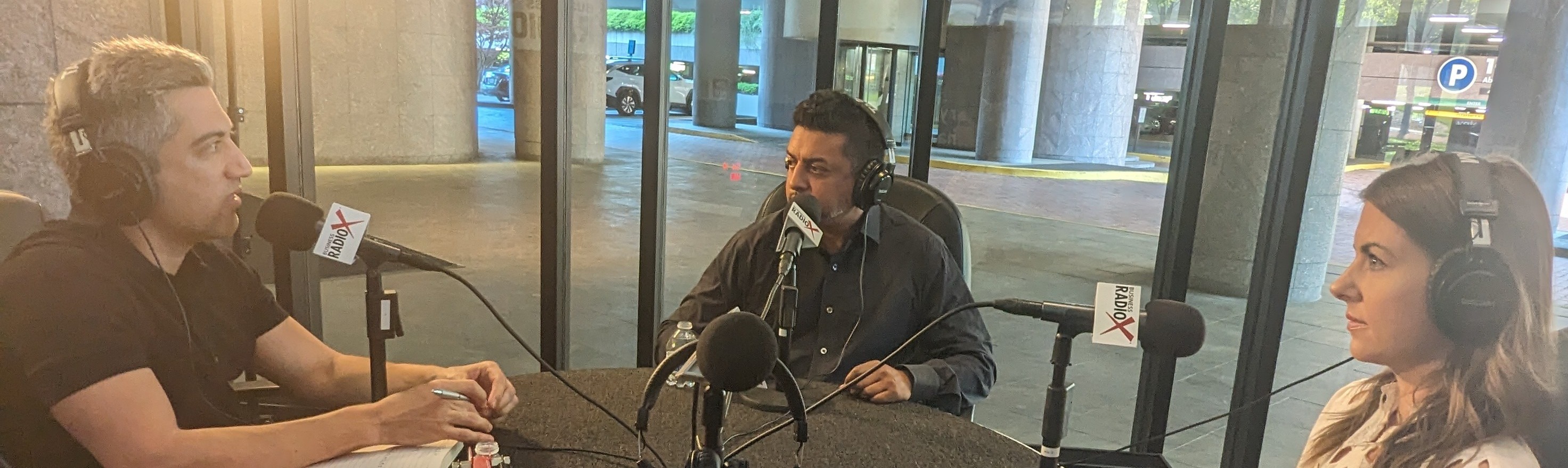 Raj Choudhury, seated in the center, recording Tech Talk with Joey Kline and Brooke MacLean