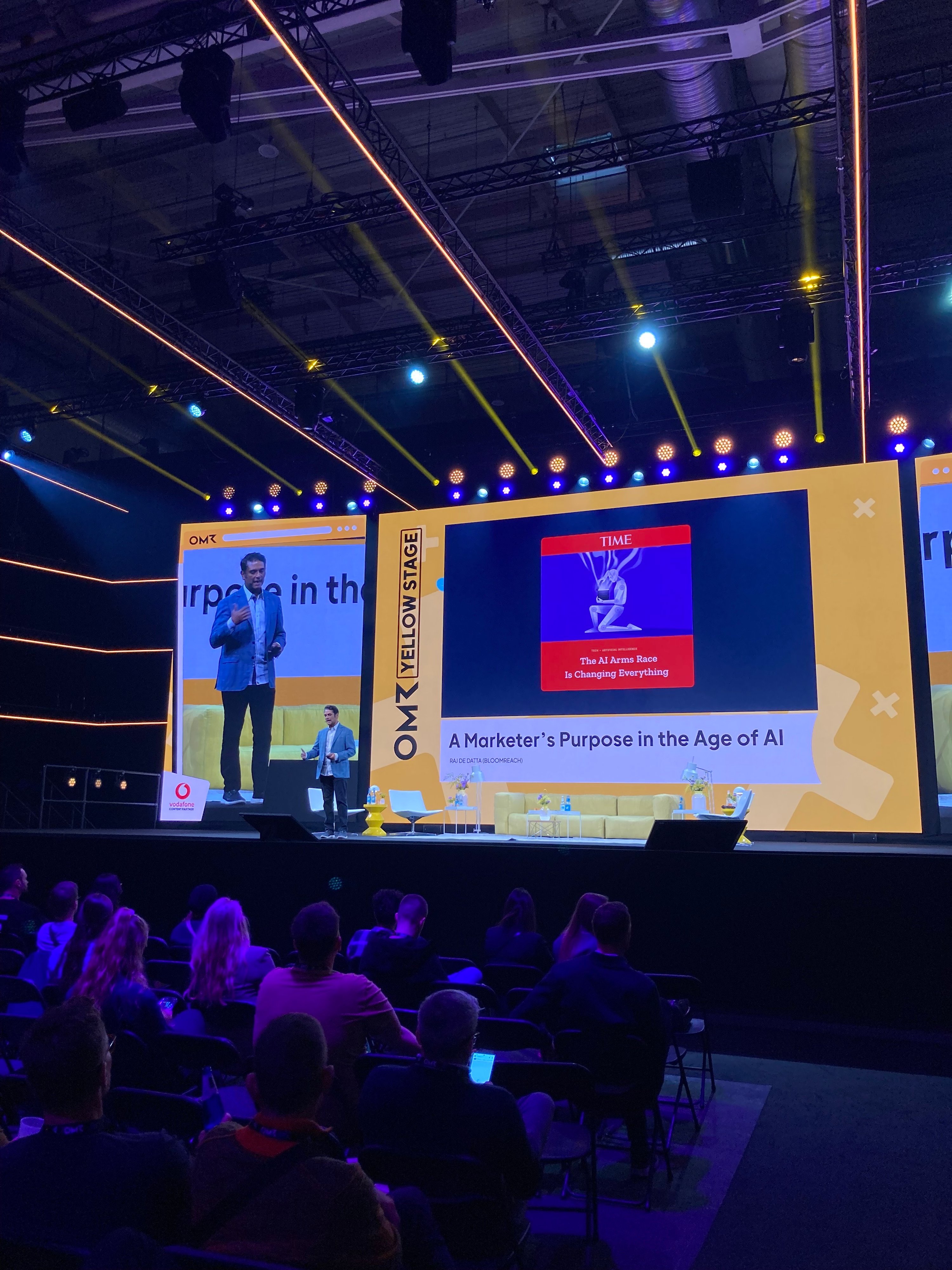 Raj De Datta speaking onstage at the OMR conference
