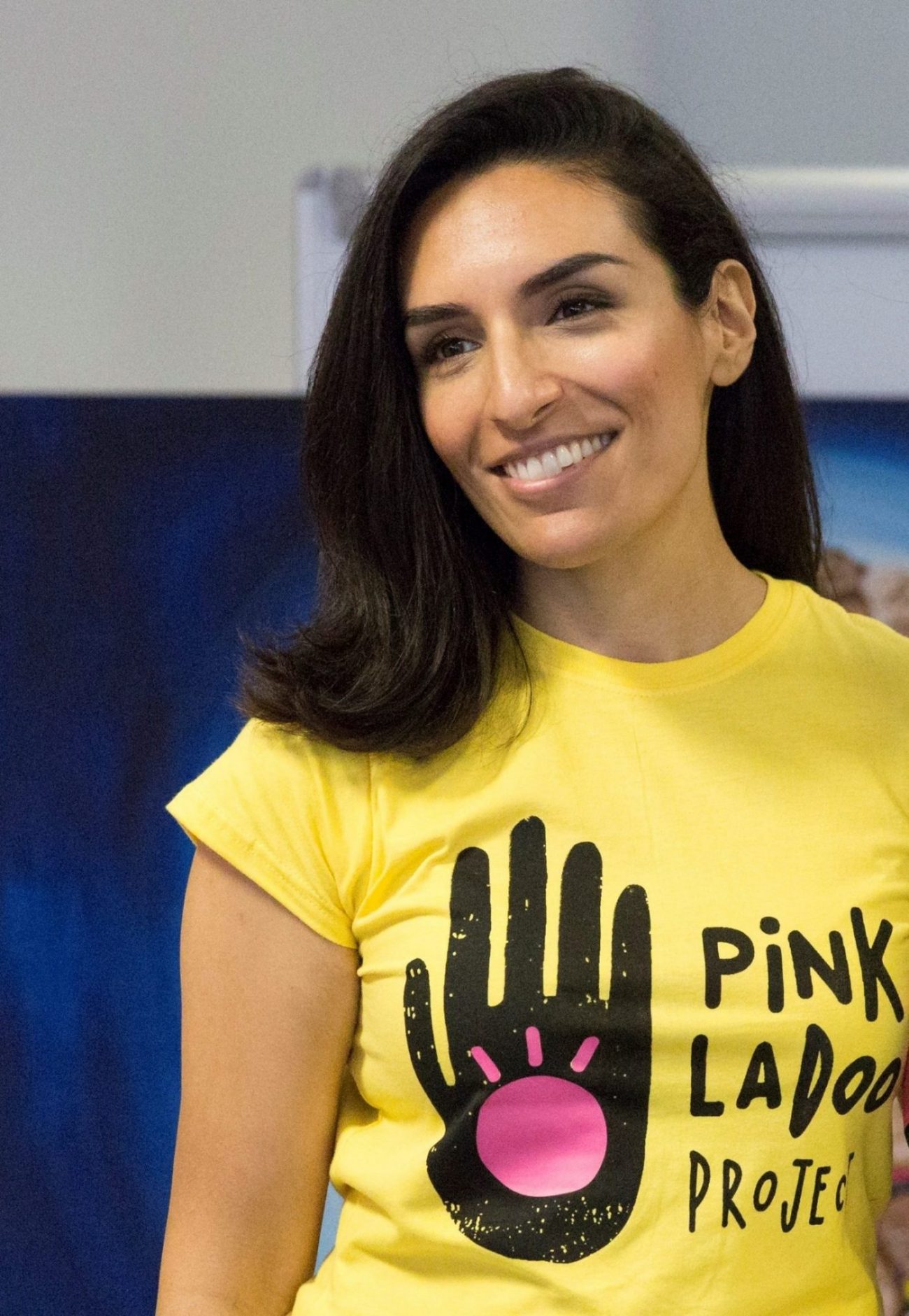 Raj Kaur Khaira wearing a yellow Pink Ladoo Project T-shirt
