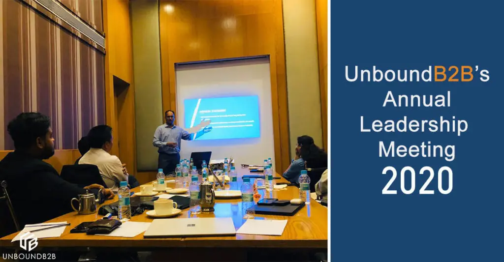 UnboundB2B team members seated around a table during the January 2020 annual leadership meeting
