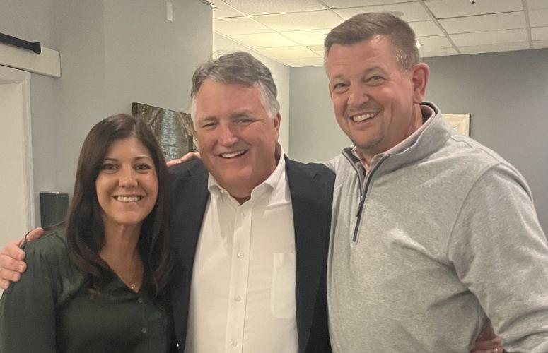 Tiffany Miller, John Lonsdorf and Scott Marioni standing together in an office