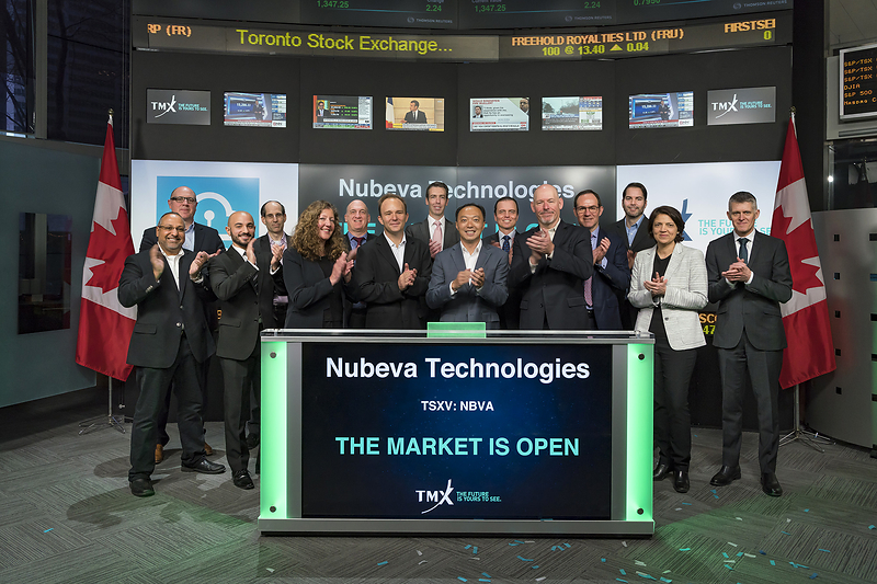 Randy Chou at the center of Nubeva’s group during its Toronto market-opening ceremony