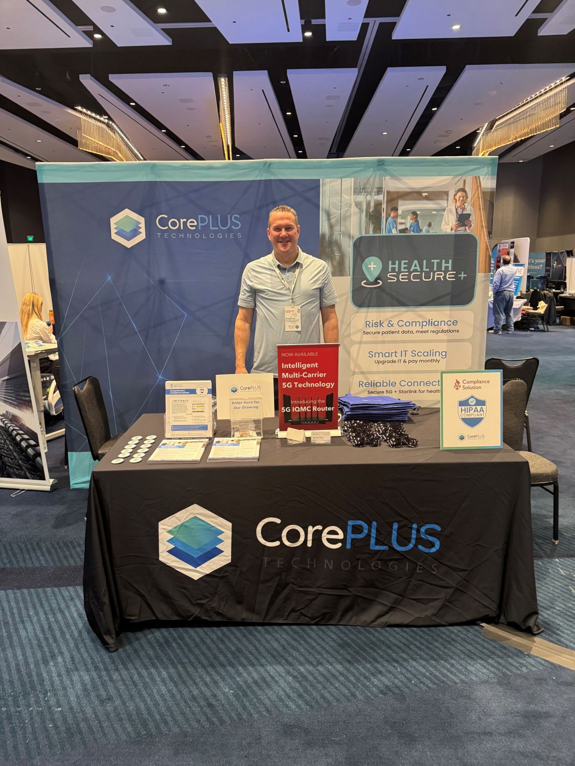 Randy Steinle standing at the CorePLUS Technologies booth during the TORCH Spring Conference