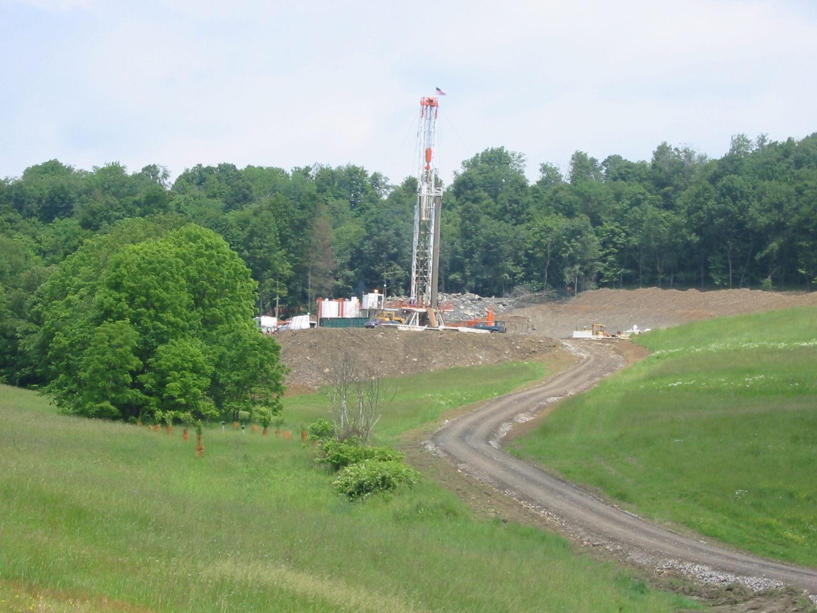 Archival photograph of the Renz drilling rig among Pennsylvania fields and woodland