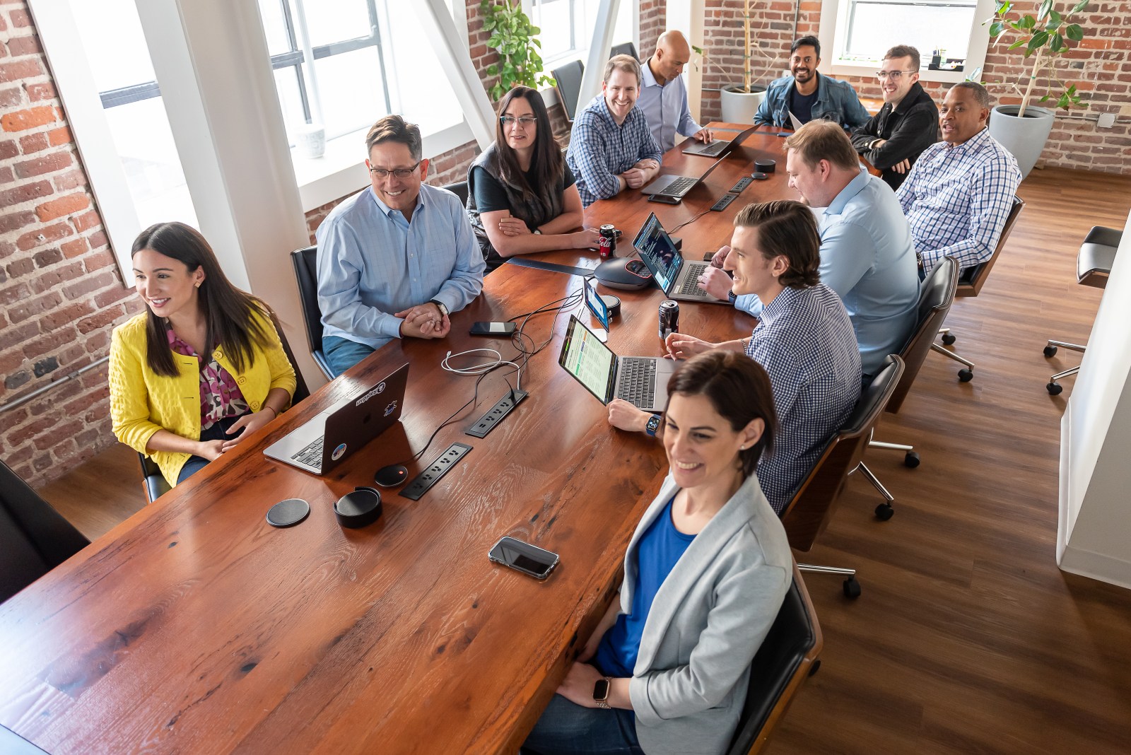 RapidAPI team members seated around a long wooden conference table