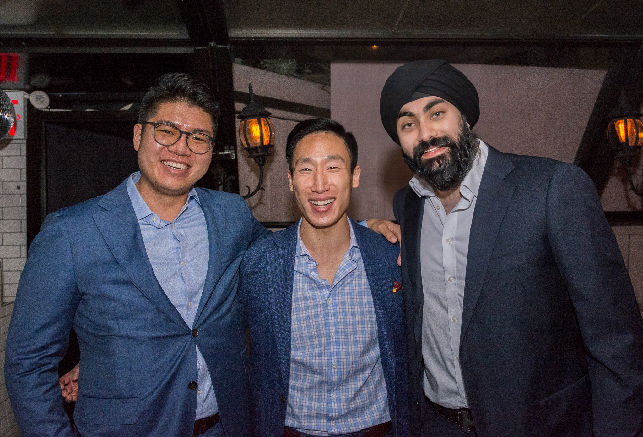 Wiley Zhang, Jerel Ho, and Raunak Nirmal standing together and smiling