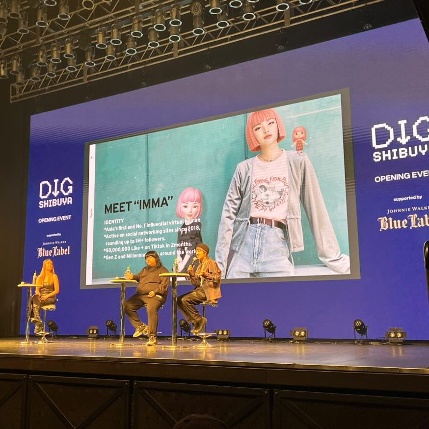 Raven Gao and fellow panelists on stage at DIG SHIBUYA in January 2024, with a virtual character displayed behind them