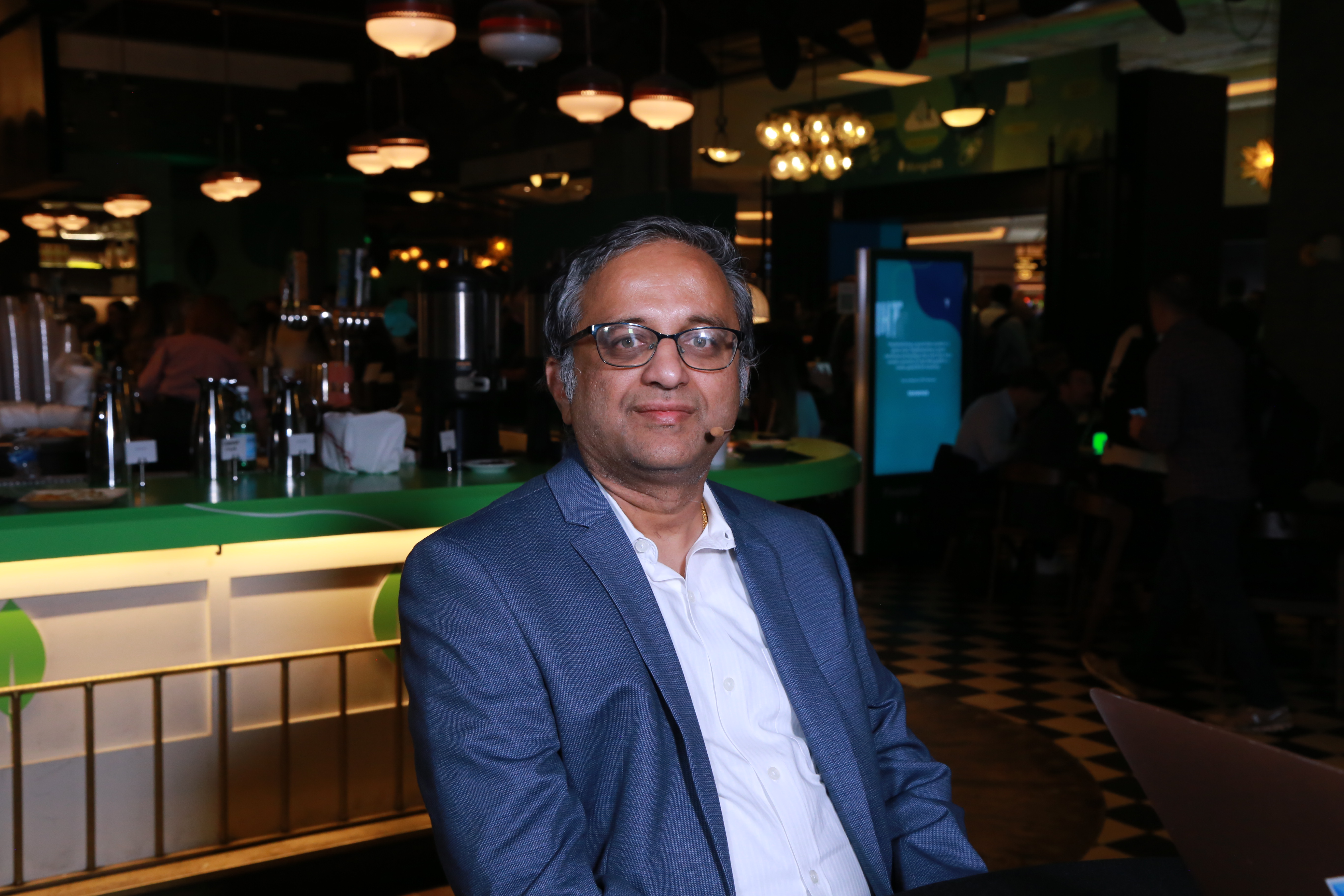 Ravikiran Dharmavaram wearing a headset microphone during a theCUBE interview