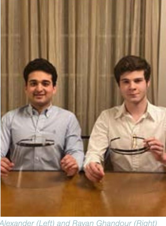 Alexander Gregoriades and Rayan Ghandour holding adjustable 3D-printed face shields in 2020