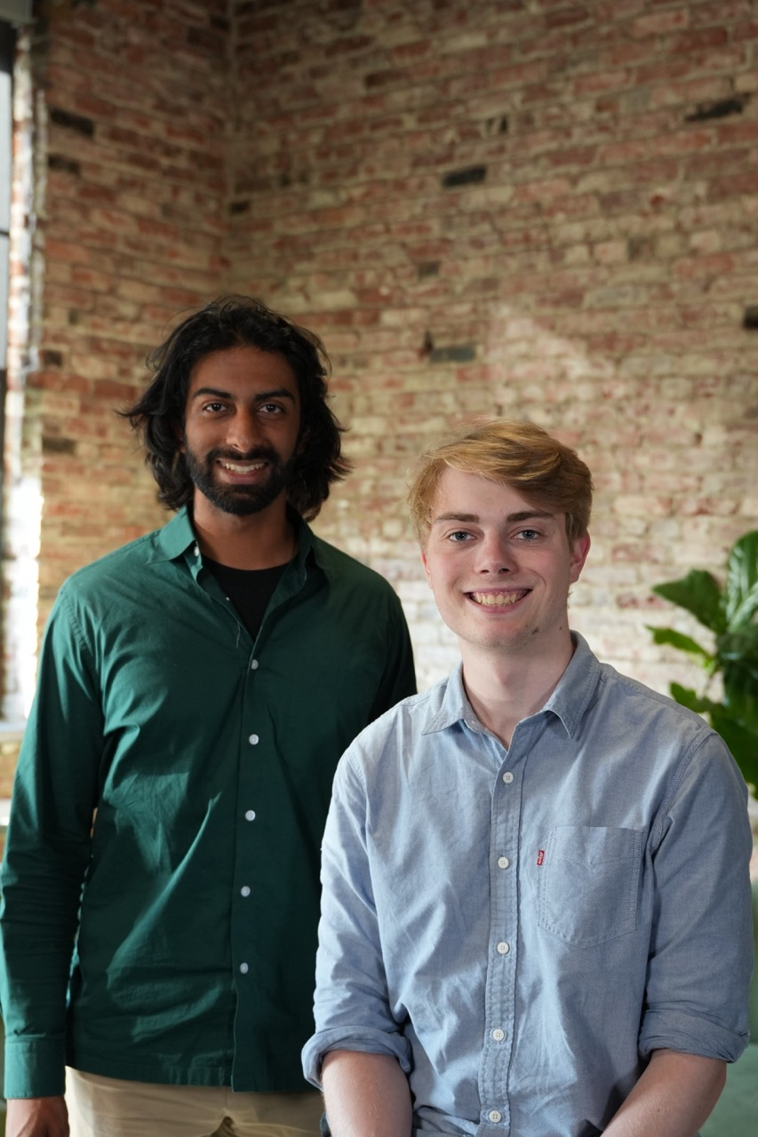 Rayan Krishnan, left, and Langston Nashold standing together in an office