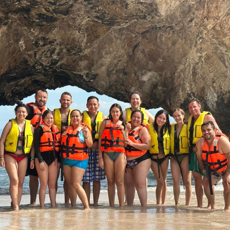 REA team members wearing life jackets during an annual company retreat