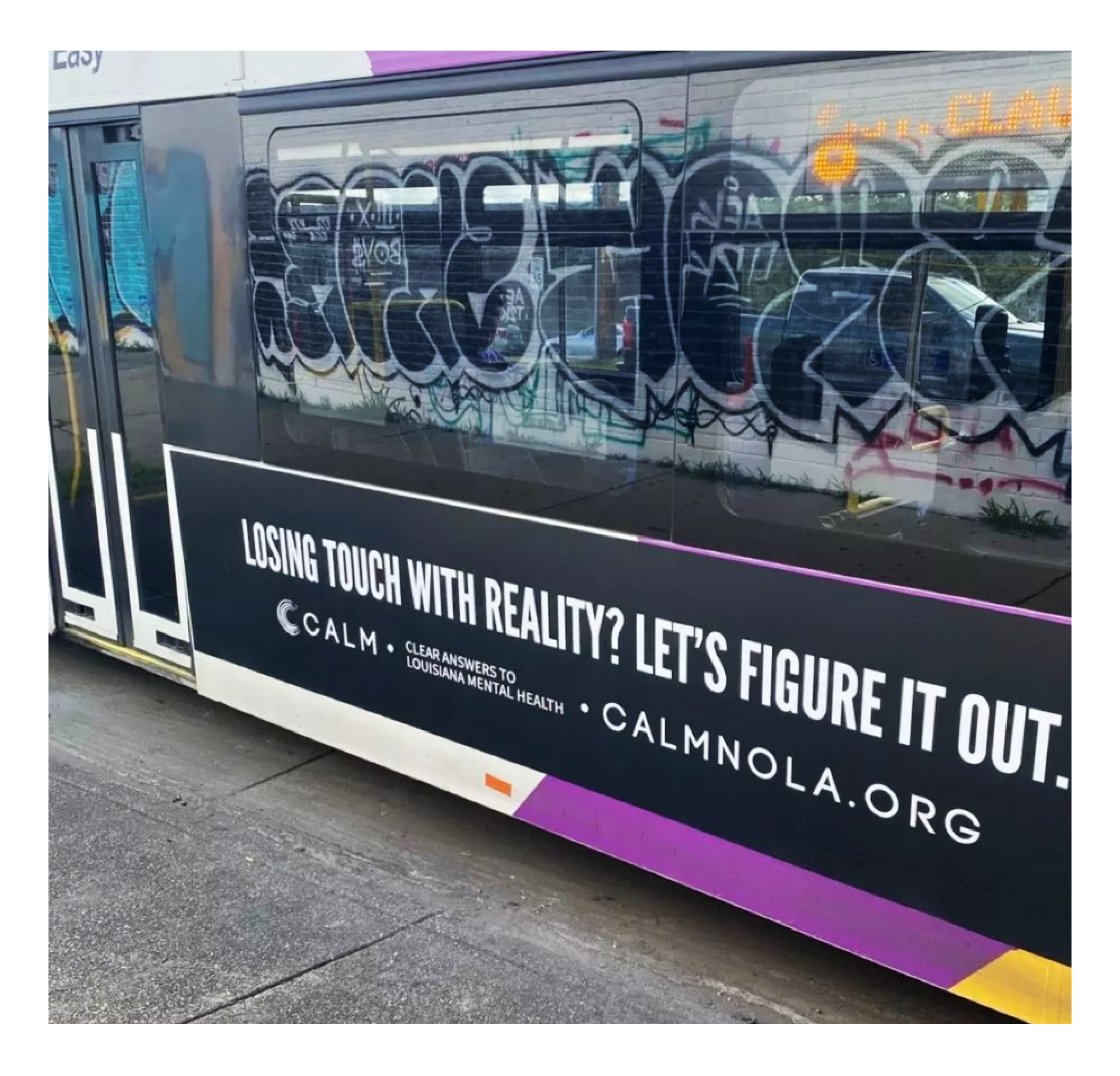 A CALM early psychosis awareness message displayed on the side of a city bus
