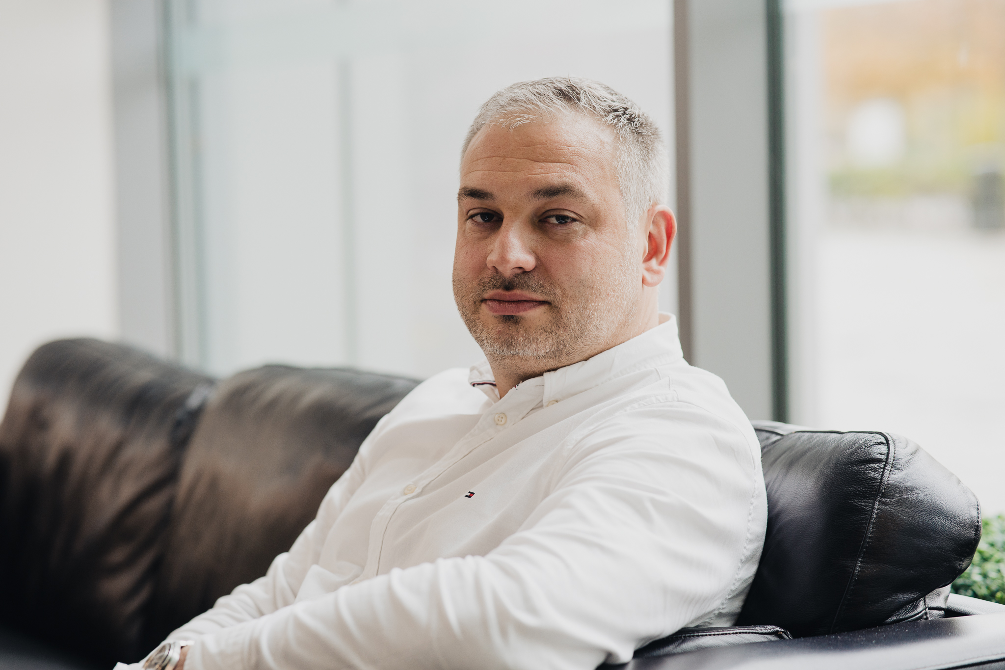 Redgate CEO Jakub Lamik seated in an office
