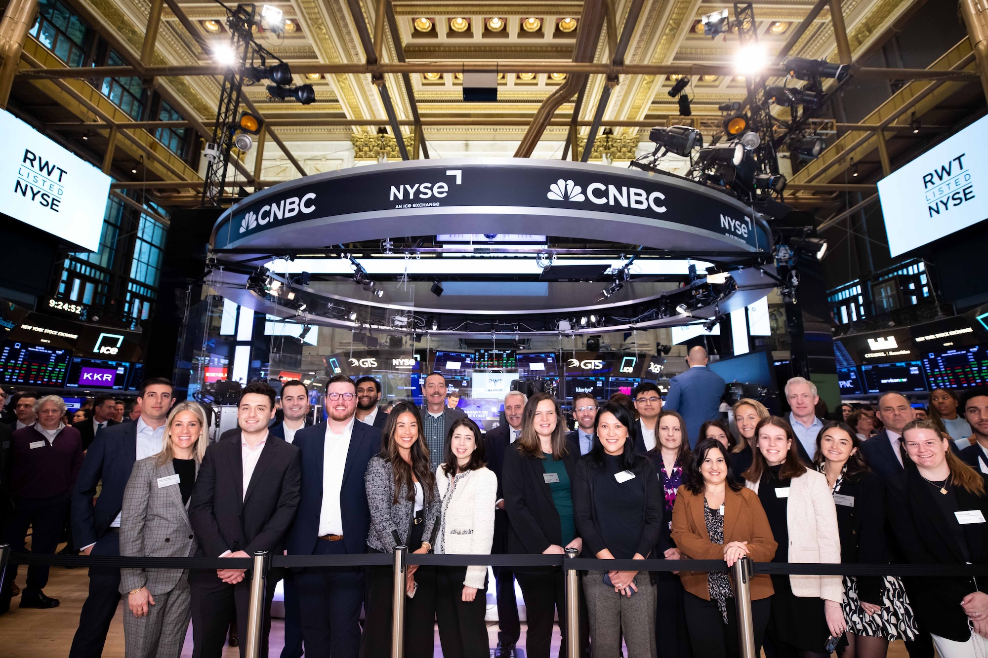 Redwood Trust colleagues gathered on the floor of the New York Stock Exchange