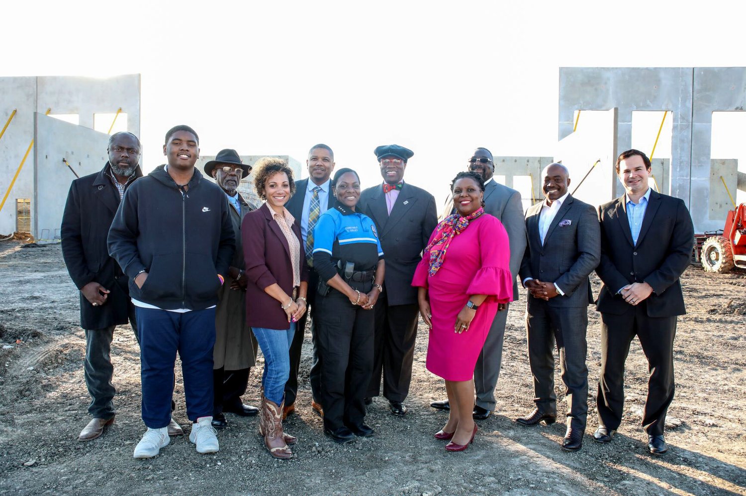 RBCA leaders and community partners standing at a South Dallas construction site