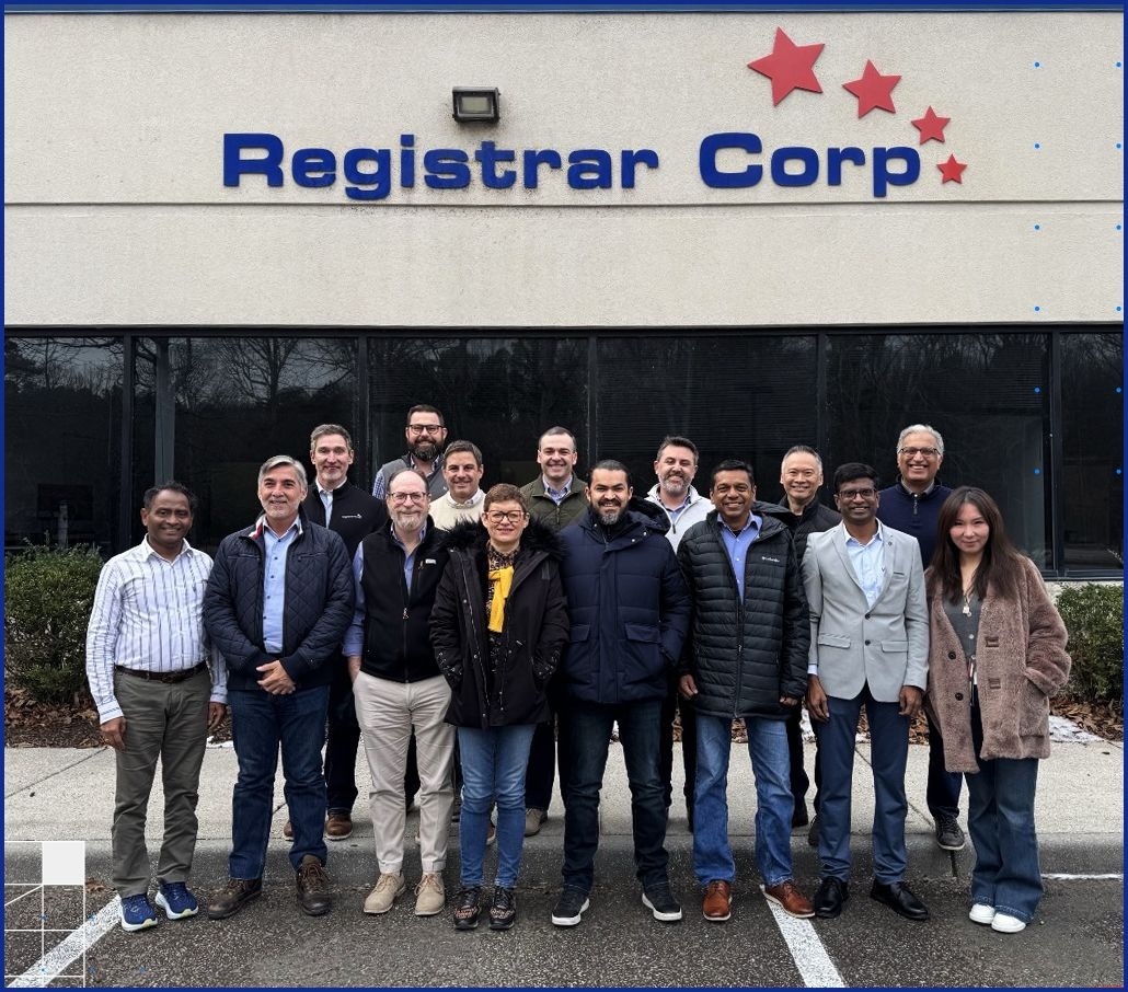 Registrar Corp leadership and regional representatives gathered outside the company office