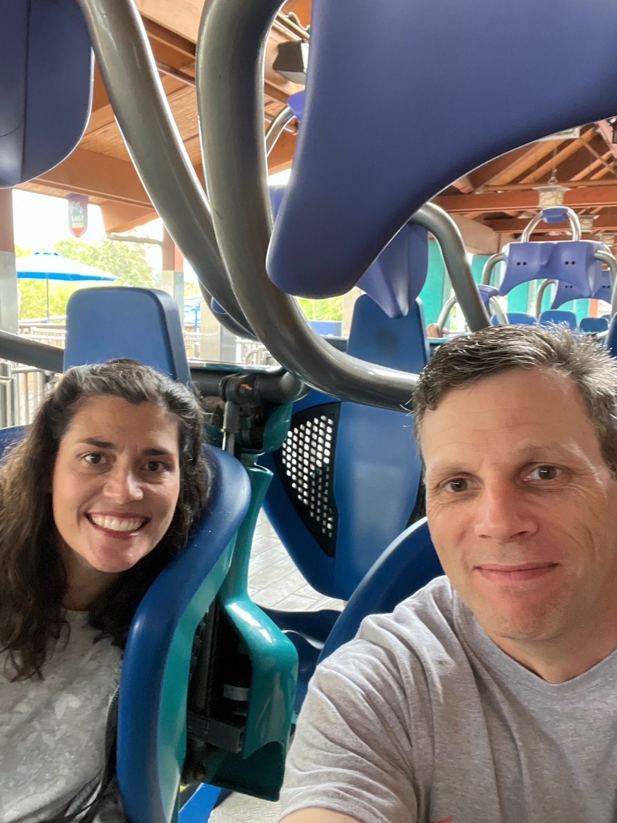 Rego founder Dan Greer, right, photographed with a companion in amusement-ride seats