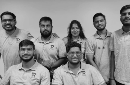 A group of Relanto team members in company polo shirts