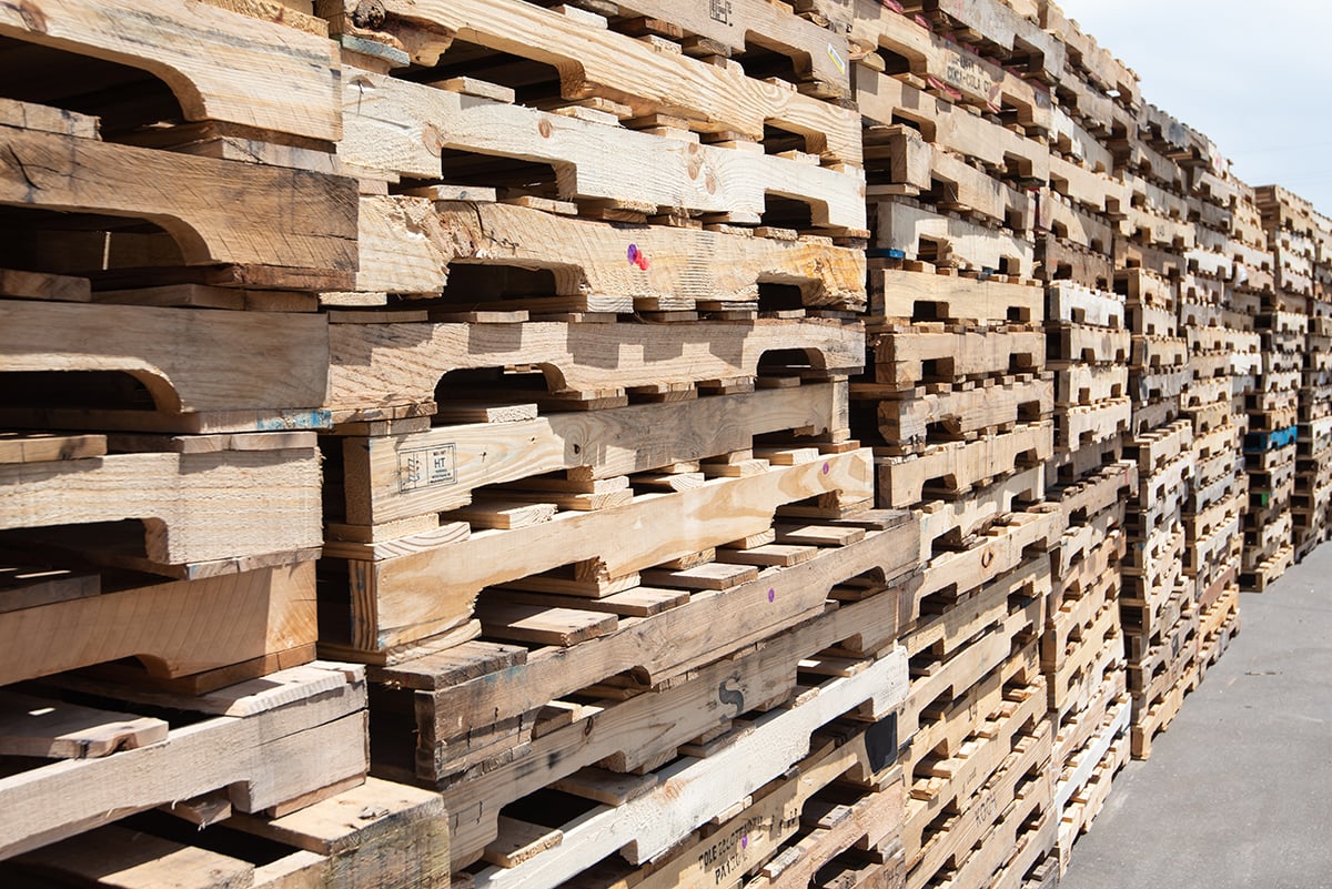 Stacks of wooden pallets pictured on Relogistics’ website